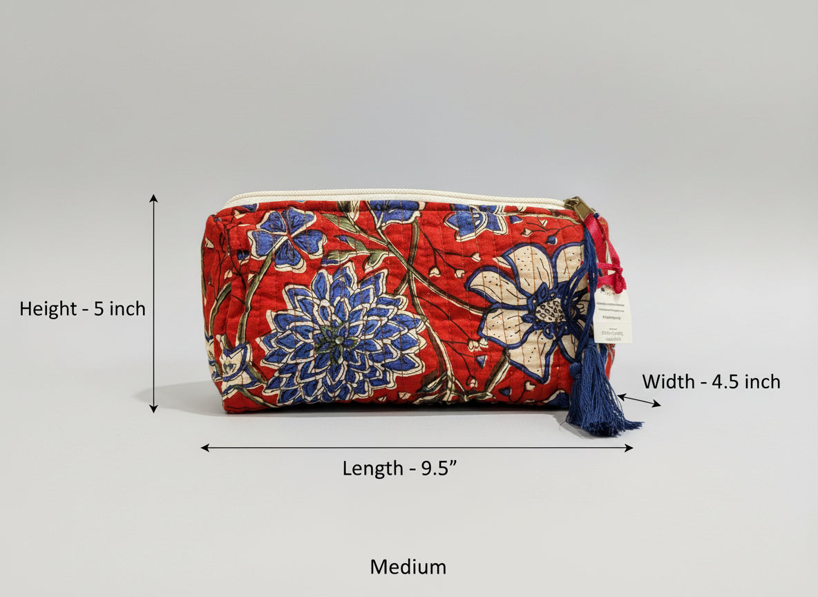 Floral-patterned pouch with a tassel on a dark background