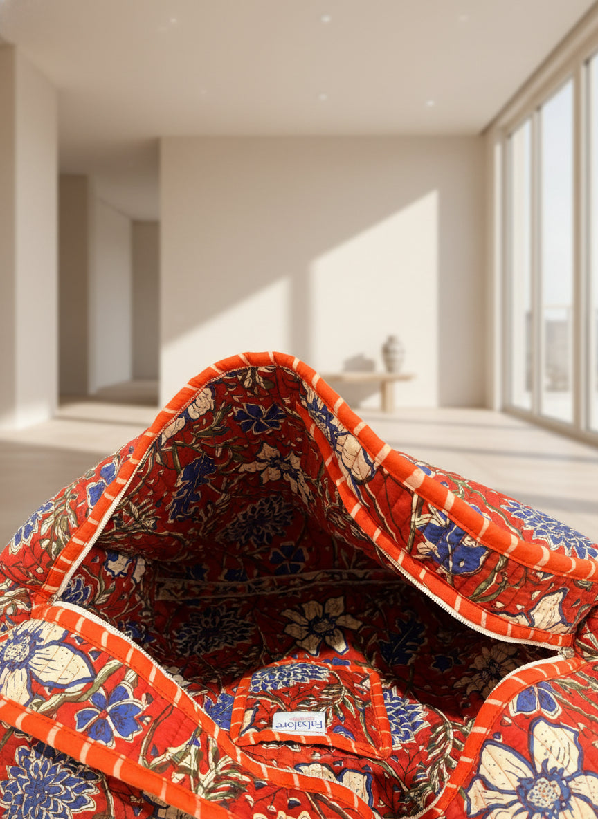 Close-up of a red floral patterned fabric with 'Fabalore' label.